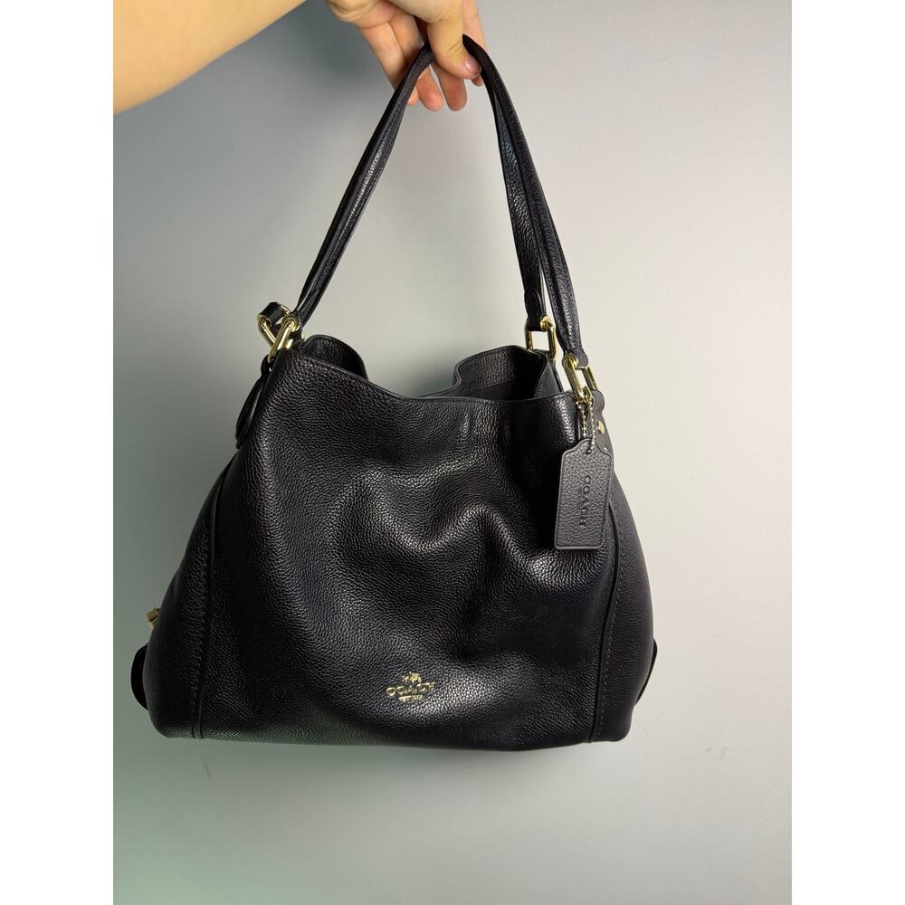 Coach Edie 31 shoulder bag in black pebbled leather.